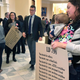 A woman holds her daughter with other mothers in a hallway, Thursday, May 2, 2019, at the Statehouse in Augusta, Maine, where the Senate was considering a bill ending non-medical vaccine exemptions. The bill passed and was signed by Governor Janet Mills (D) on Friday.